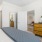 a bedroom with a bed and dresser