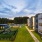 buildings with a playground and a grassy area