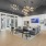 a clubhouse room with couches, chairs and a tv