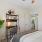 a bedroom with a bed and a fan