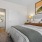 a bedroom with a bed and a lamp