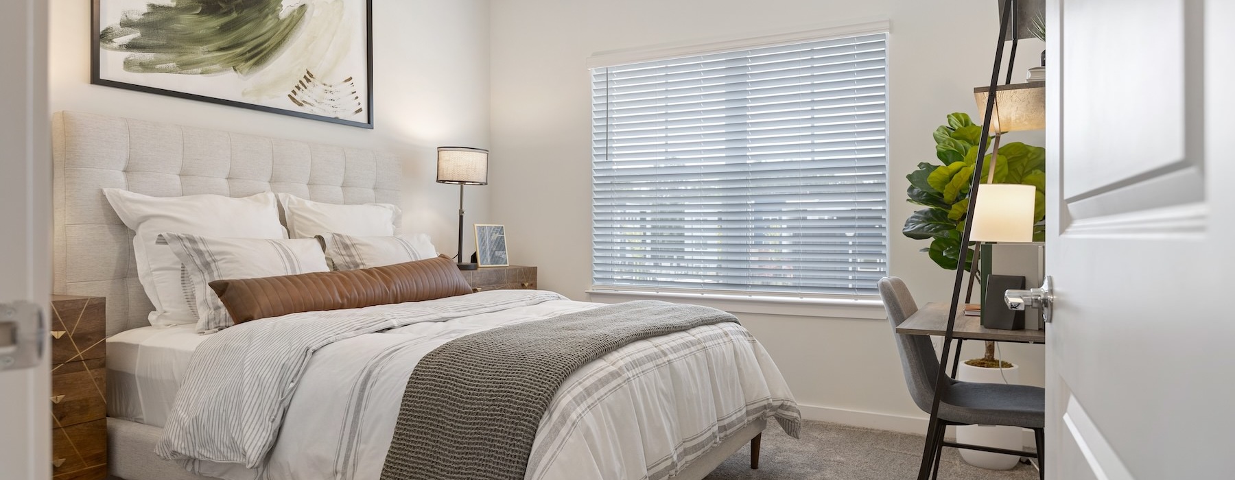 a bedroom with a bed and a chair