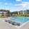 a swimming pool with lounge chairs around it