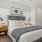 a bedroom with a bed and a table