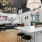 a clubhouse kitchen with a bar and stools
