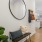 a room with a couch and a mirror