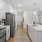 a kitchen with white cabinets