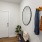 a room with a mirror and a chair