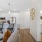 a kitchen and living room with a couch and chairs