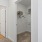 an empty bedroom with open doors