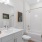 a bathroom with a tub toilet and sink