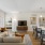 a living room with a large kitchen