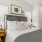 a bedroom with a bed and a table